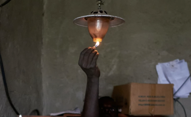 Man lighting a gas lamp_Peng Liu WB