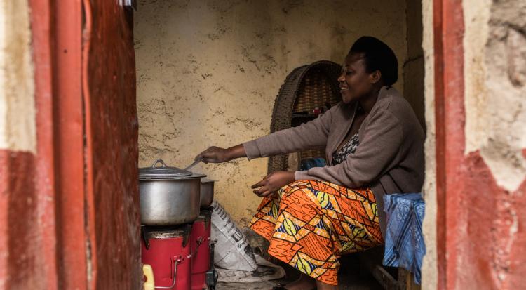 Therese Mukamana uses a biomass stove in Gyseny, Rwanda.